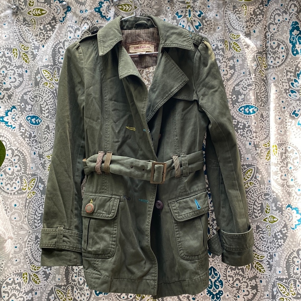 Size small green trench, fun colorful details and inside pattern.